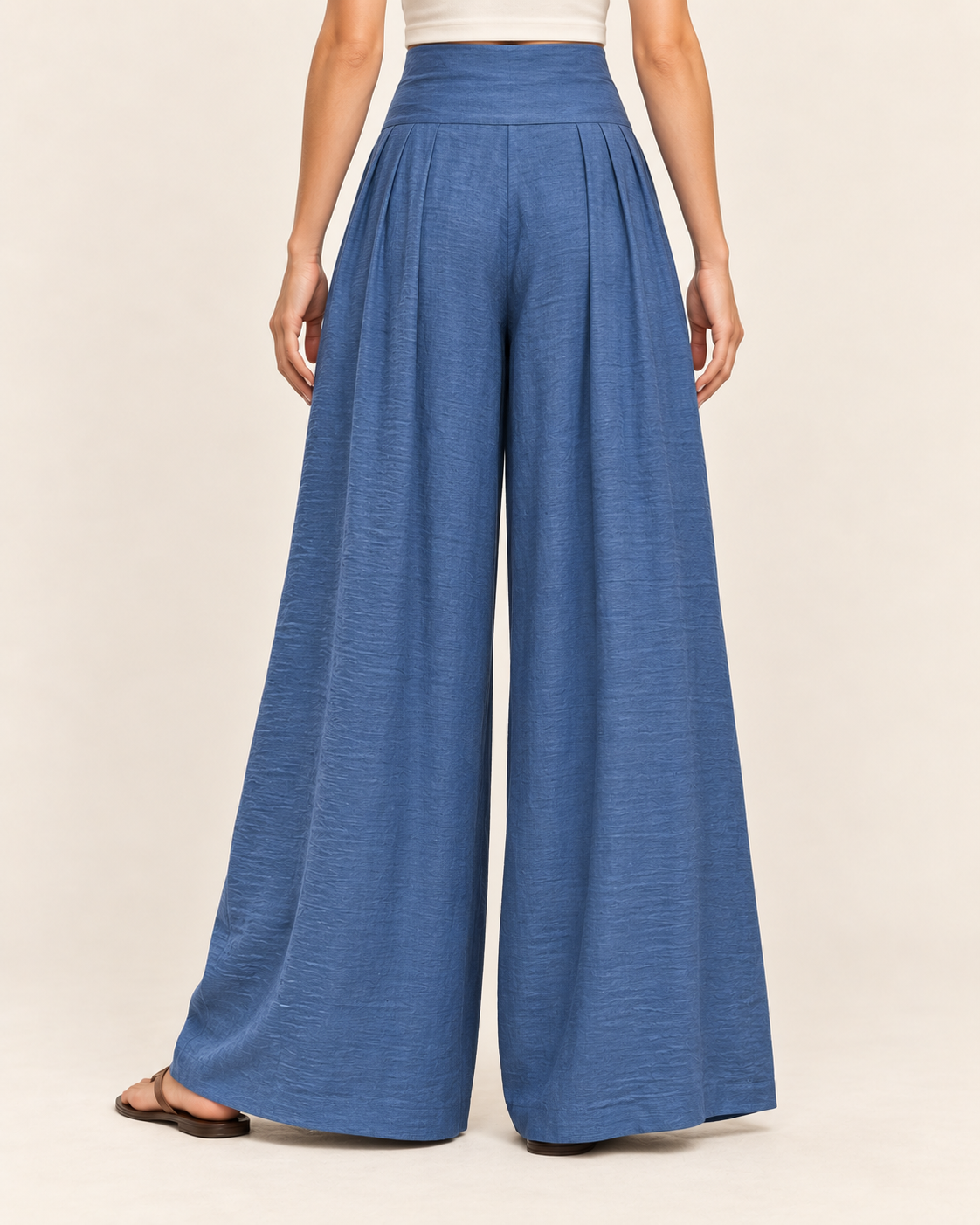 Women's High Waisted Wide Leg Trousers with Pleats and Tie Waist in Blue, back view