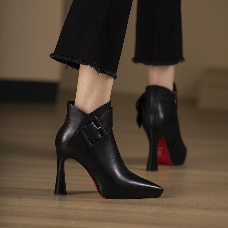 Women's Pointed Toe Leather Ankle Boots with Buckle and Flared Heel in Black, on model