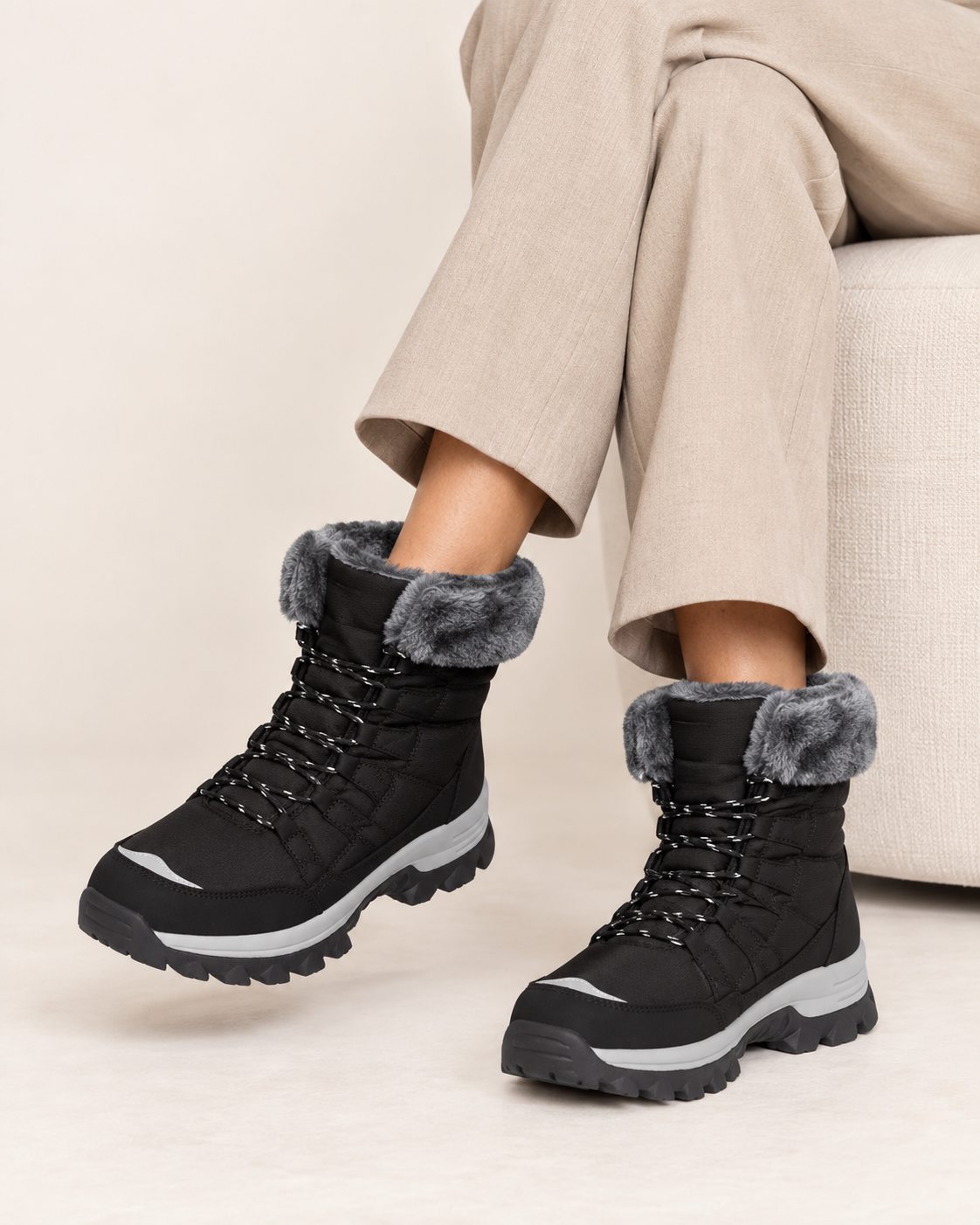 Women's Lace Up Snow Boots with Faux Fur Collar and Chunky Sole in Black, on model